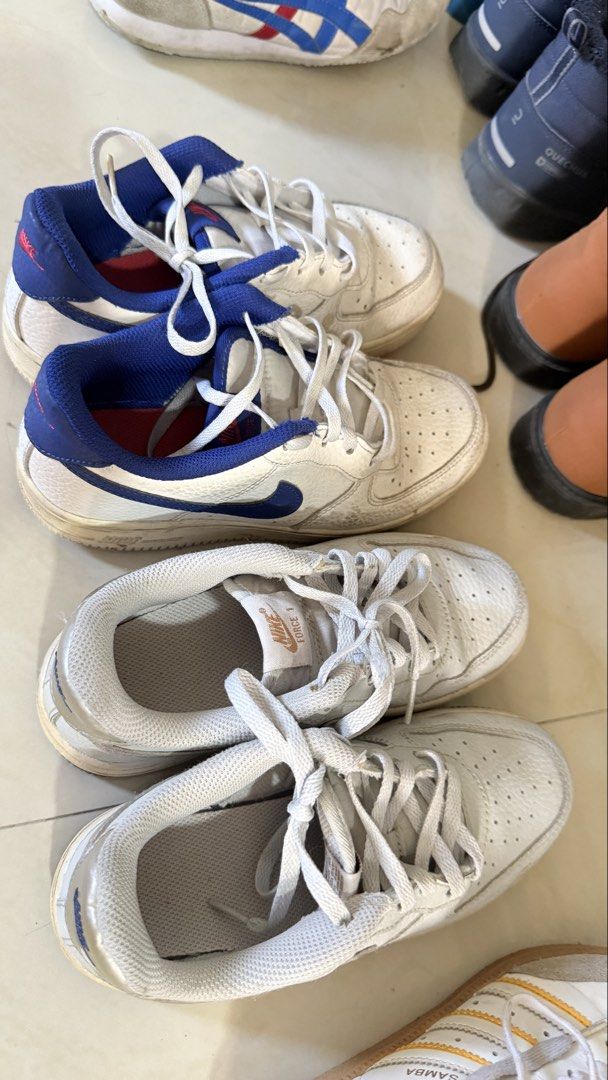 Nike Air Force 1 Sneakers (Category: Babies & Kids Fashion) located in Quezon City. Submitted by amagenie (Listing ID 1470778981, Image 3). Description: - Bundle deal: 2 pairs of Nike Air Force 1 Low sneakers - Colorway 1: Classic white leather with blue swoosh and heel tab - Colorway 2: White leather with silver heel accents and tongue branding - Includes original laces for both pairs - Perfect everyday streetwear rotation If 1 pair - 800 pesos.
