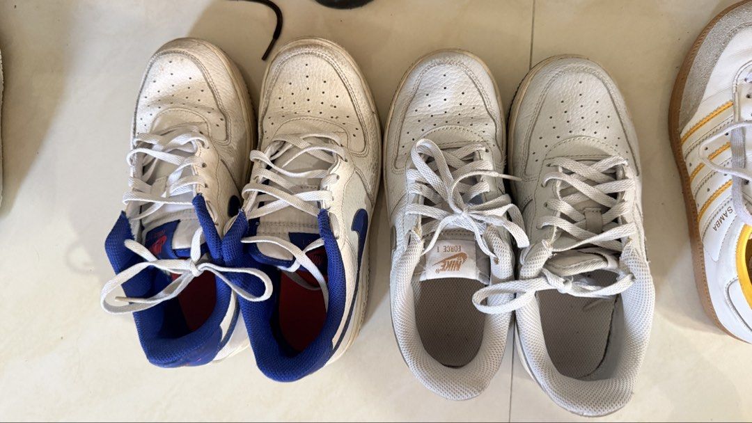 Nike Air Force 1 Sneakers (Category: Babies & Kids Fashion) located in Quezon City. Submitted by amagenie (Listing ID 1470778981, Image 2). Description: - Bundle deal: 2 pairs of Nike Air Force 1 Low sneakers - Colorway 1: Classic white leather with blue swoosh and heel tab - Colorway 2: White leather with silver heel accents and tongue branding - Includes original laces for both pairs - Perfect everyday streetwear rotation If 1 pair - 800 pesos.