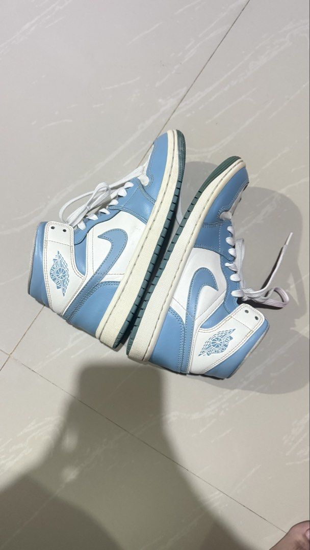 Nike Air Jordan 1 Mid UNC (Category: Sneakers) located in Manila. Submitted by akiii222 (Listing ID 1470889123, Image 3). Description: Nike Air Jordan 1 Mid UNC US 6W Original. Bought this for 8,500 back then with signs of usage such as creases but still in good condition :) rfs: not using it anymore and not my style na Location: Laguna/Makati can do: J&T/Lalamove .
