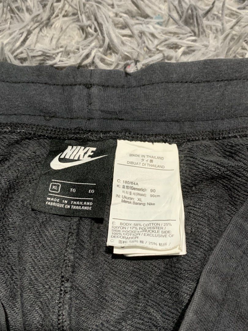 Nike Alumni Black Sweatshorts (Category: Shorts) located in Tayug. Submitted by cvcthrift (Listing ID 1470897584, Image 2). Description: W-33-38 L-20 VGUC CR-9/10 - Brand: Nike - Item: Sweatshorts - Color: Black with large white Nike swoosh and logo on left leg - Size: XL - Material: 58% cotton, 25% rayon body; 100% cotton pockets - Features: Adjustable drawstring waistband with white cords - Origin: Made in Thailand - Style Code: AR2376-010.