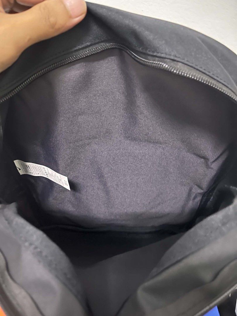 Nike Black Backpack with White Logo (Category: Backpacks) located in Caloocan City. Submitted by sarahastrid (Listing ID 1470866407, Image 2). Description: - Brand: Nike - Color: Black with large white front logo - Condition: Brand new, never used (original swing tag attached) - Features: Top zip closure, dark grey interior lining, adjustable padded back straps - Inclusions: Original product tag attached inside.