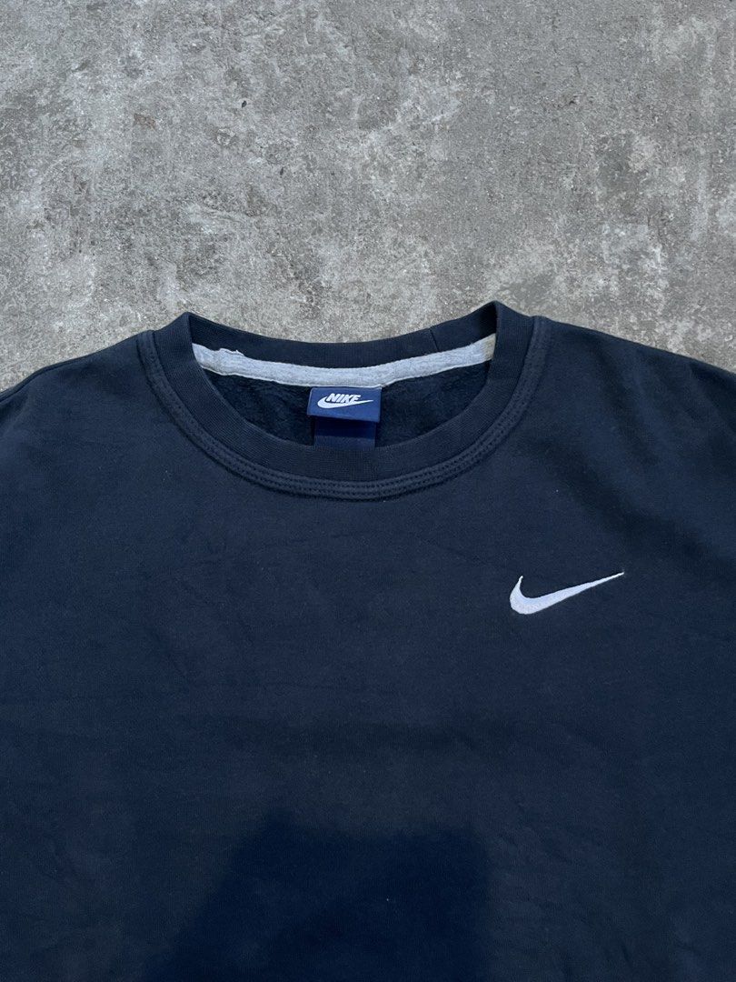 Nike Black Crewneck Sweatshirt Size S (Category: Coats, Jackets and Outerwear) located in Caloocan City. Submitted by fairfits (Listing ID 1470791023, Image 2). Description: - Brand: Nike - Style: Classic crewneck sweatshirt - Color: Solid black with white embroidered swoosh on chest - Size: Small - Material: Soft interior fleece lining with ribbed collar, cuffs, and hem - Condition: Excellent, clean minimalist piece - Perfect for: Everyday stree