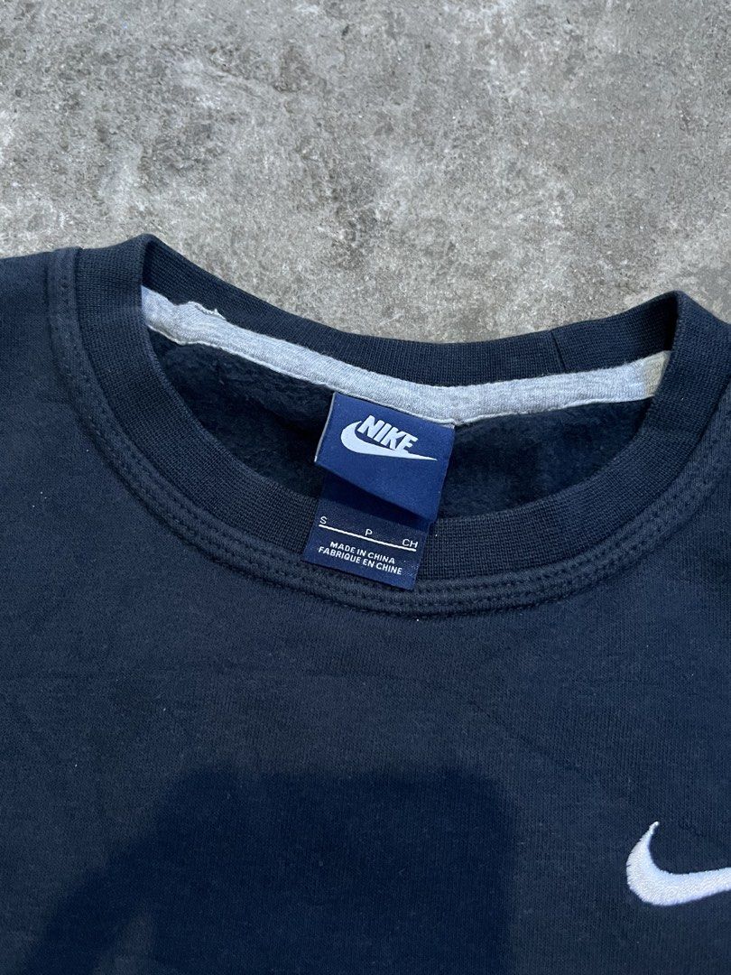 Nike Black Crewneck Sweatshirt Size S (Category: Coats, Jackets and Outerwear) located in Caloocan City. Submitted by fairfits (Listing ID 1470791023, Image 3). Description: - Brand: Nike - Style: Classic crewneck sweatshirt - Color: Solid black with white embroidered swoosh on chest - Size: Small - Material: Soft interior fleece lining with ribbed collar, cuffs, and hem - Condition: Excellent, clean minimalist piece - Perfect for: Everyday stree