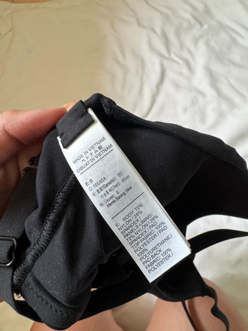 Nike Black Sports Bra Size S (Category: Activewear) located in Cebu City. Submitted by _t.rix (Listing ID 1470749944, Image 3). Description: - Brand: Nike - Color: Black with white Swoosh logo on back band - Size: S (fits true to size) - Condition: Clean, worn a few times - Features: Adjustable straps, removable padding, comfortable stretchy material.