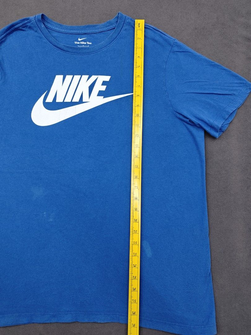 Nike Blue White Logo The Nike Tee (Category: Tshirts & Polo Shirts ) located in Bulacan. Submitted by pzj_thrift (Listing ID 1470778879, Image 3). Description: condition 9/10 color rate 9/10 issue white stain/ pinhole.