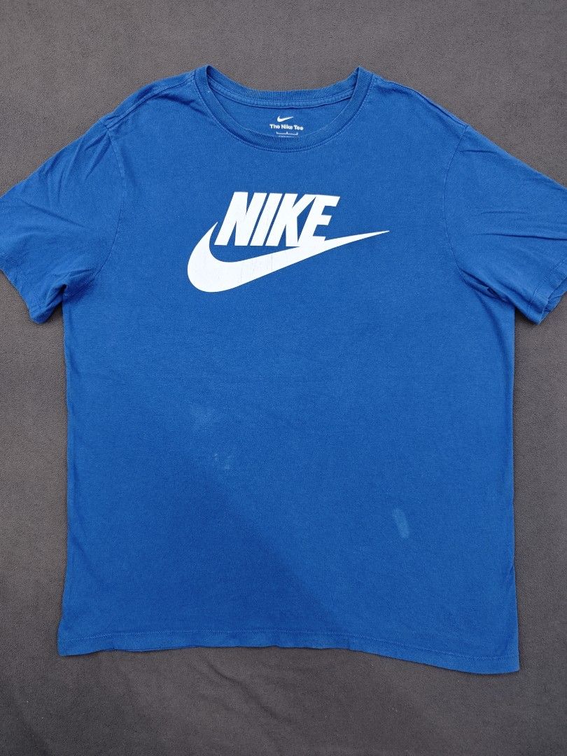 Nike Blue White Logo The Nike Tee (Category: Tshirts & Polo Shirts ) located in Bulacan. Submitted by pzj_thrift (Listing ID 1470778879, Image 1). Description: condition 9/10 color rate 9/10 issue white stain/ pinhole.