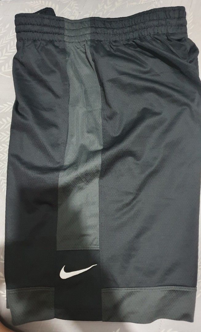 Nike Dri-FIT Black Shorts Size L (Category: Shorts) located in Cainta. Submitted by origeetostore (Listing ID 1470861654, Image 2). Description: - Brand: Nike Dri-FIT - Color: Black - Size: L - Material: 100% Polyester with breathable mesh back panel - Features: Elastic waistband, white Nike swoosh logo on lower leg - Condition: Brand new with clean tags attached - Origin: Made in Thailand - Best for: Running, gym workouts, and casual streetwear 