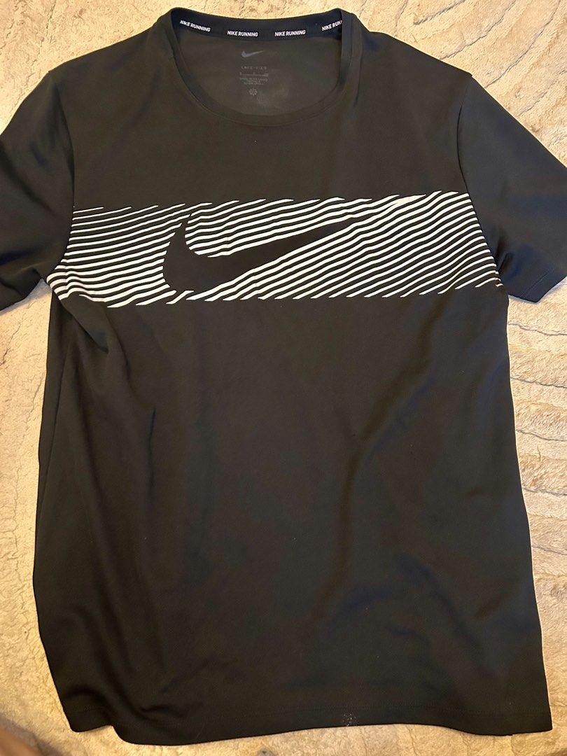 Nike Dri-FIT Running Shirts and Nike Pro Compression Top Bundle (Category: Activewear) located in Mandaluyong City. Submitted by kyliekaye (Listing ID 1470779492, Image 3). Description: - Brand: Nike - Bundle of 3 athletic shirts (Size: Small) - 2x Nike Running Dri-FIT tees (Colors: Black with white graphics, Beige camo print) - 1x Nike Pro tight-fit long sleeve top (Color: Black) - Material: 100% polyester - Ideal for running, gym sessions, and 