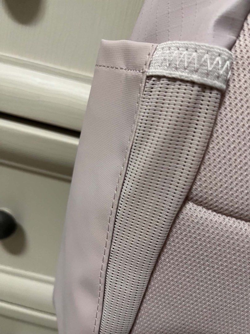 Nike Eugene Winterized Pink Grid Backpack 20L (Category: Backpacks) located in Caloocan City. Submitted by sarahastrid (Listing ID 1470866278, Image 3). Description: - Brand: Nike - Capacity: 20L - Color/Design: Pale pink with grid pattern - Condition: Brand new with original tag attached - Compartments: Front zippered compartment, main zipped section with inner slip pocket, and side pockets - Comfort: Padded mesh shoulder straps and back panel -