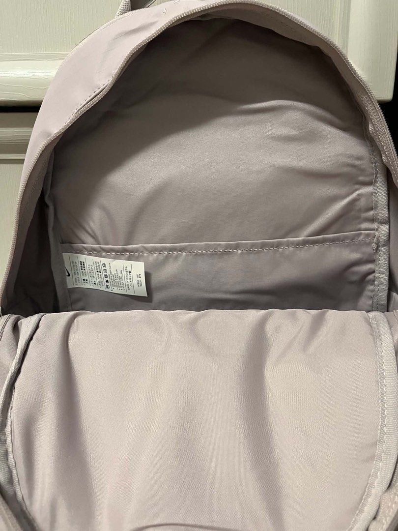 Nike Eugene Winterized Pink Grid Backpack 20L (Category: Backpacks) located in Caloocan City. Submitted by sarahastrid (Listing ID 1470866278, Image 2). Description: - Brand: Nike - Capacity: 20L - Color/Design: Pale pink with grid pattern - Condition: Brand new with original tag attached - Compartments: Front zippered compartment, main zipped section with inner slip pocket, and side pockets - Comfort: Padded mesh shoulder straps and back panel -