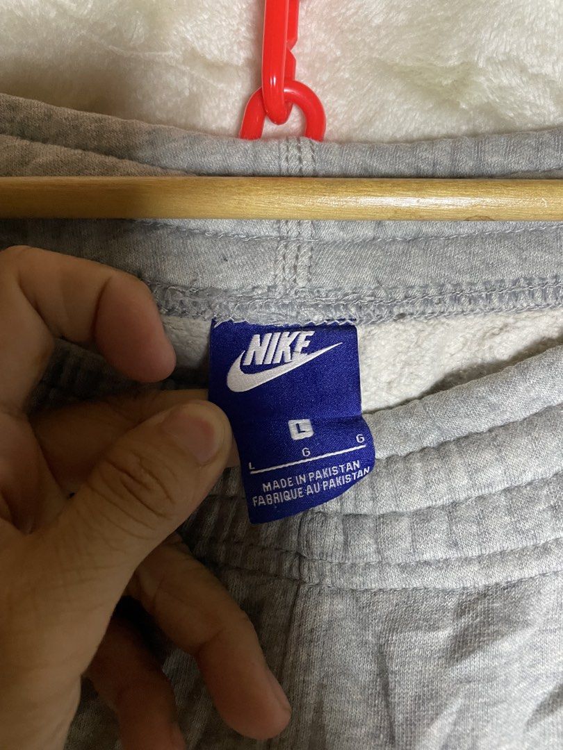 Nike Gray Sweatpants Size L (Category: Joggers) located in Molave. Submitted by charlesthrifter (Listing ID 1470854017, Image 2). Description: - Brand: Nike - Color: Heather Gray - Size: Large (L) - Material: Soft fleece inside, comfortable fit - Details: Elastic waistband with drawstring, embroidered white Nike swoosh on left leg - Origin: Made in Pakistan - Condition: need wash may stain.