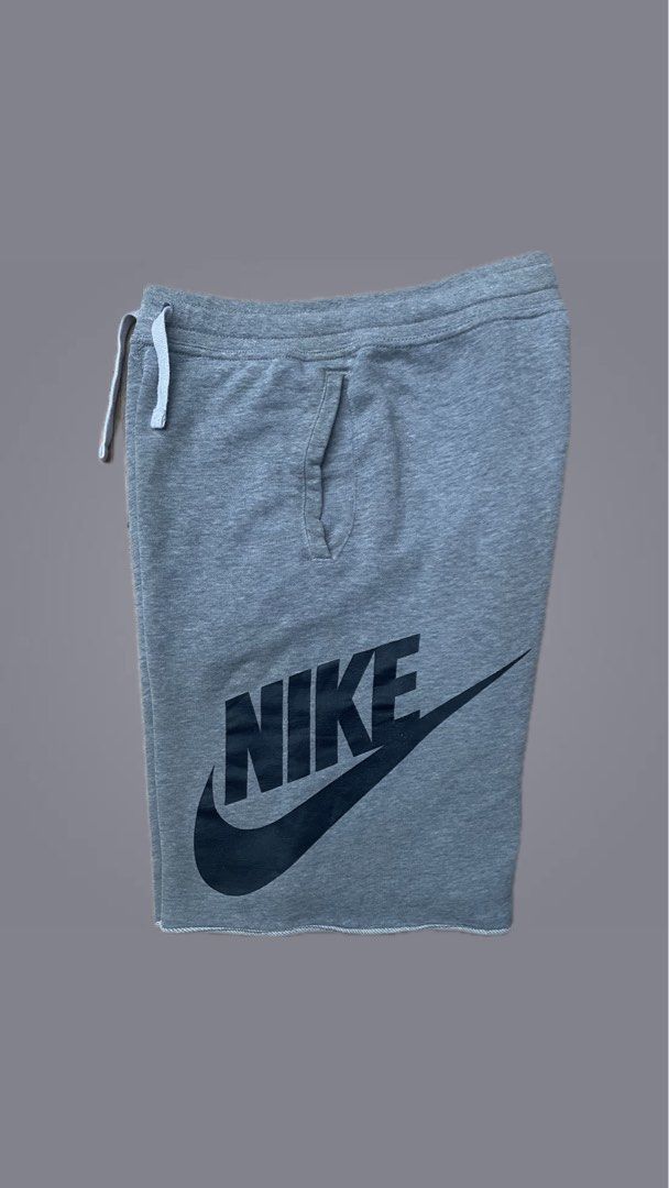 Nike Grey Cotton Fleece Shorts (Category: Shorts) located in Cebu City. Submitted by pinoclifford (Listing ID 1470834956, Image 1). Description: - Brand: Nike - Item: Grey shorts with black graphic logo - Size: Large (L) - Material: 80% Cotton, 20% Polyester - Features: Adjustable drawstring waistband and two functional side pockets - Origin: Made in Malaysia - Style Code: 728206-063 - Condition: Excellent.
