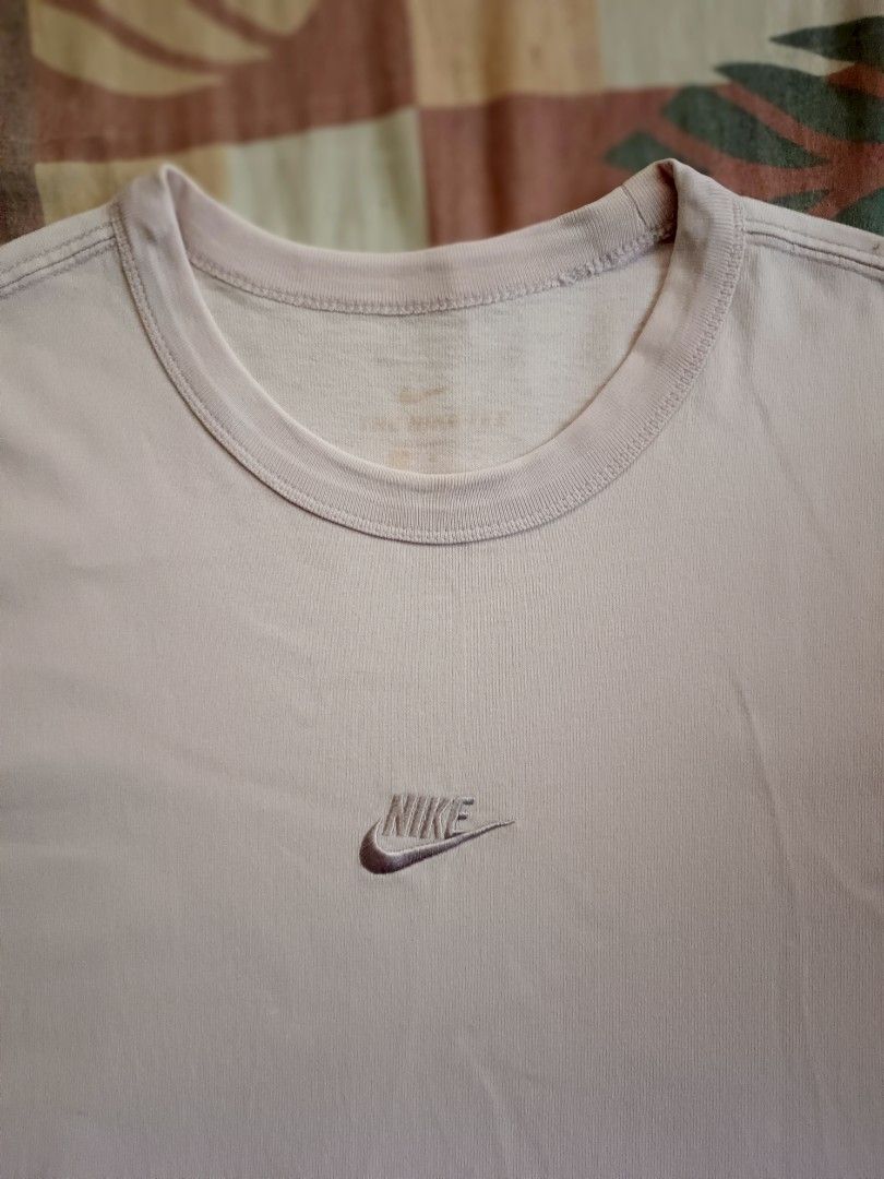 Nike mid swoosh logo tshirt (Category: Activewear) located in Odiongan. Submitted by thriftngo26 (Listing ID 1470759570, Image 2). Description: This item is the Nike Sportswear Premium Essential T-Shirt in Iced Lilac (Style Code: DB3194-576). It is characterized by its heavyweight cotton construction, loose/relaxed fit, and a small embroidered Nike Futura logo centered directly on the chest..