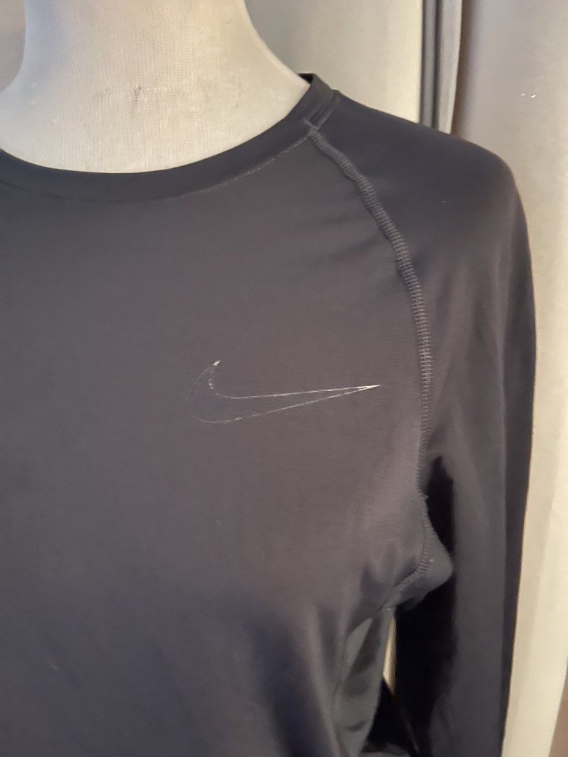 Nike Pro Dri-FIT Black Long Sleeve Top (Category: Longsleeves) located in Cainta. Submitted by zlove111 (Listing ID 1470789515, Image 2). Description: - Brand: Nike Pro - Style: Dri-FIT long sleeve top - Color: Black - Size: Small can fit up to large womens - Condition: Pre-loved with noticeable wear and slight piling on one elbow part . may rub - Features: Stretchy performance fabric, ribbed neckline taping, subtle chest swoosh - Ideal for: Work