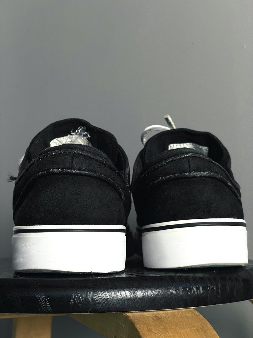 Nike SB Stefan Janoski Black Tiffany (Category: Sneakers) located in Caloocan City. Submitted by ceflores97696 (Listing ID 1470841836, Image 3). Description: - Model: Nike Stefan Janoski skate shoes - Upper: Black suede with vibrant turquoise embroidered swoosh - Details: Signature teal tongue label, clean stitching, and grey leather laces included - Sole: White vulcanized midsole with black outsole offering solid grip - Condition: Minimal wear o
