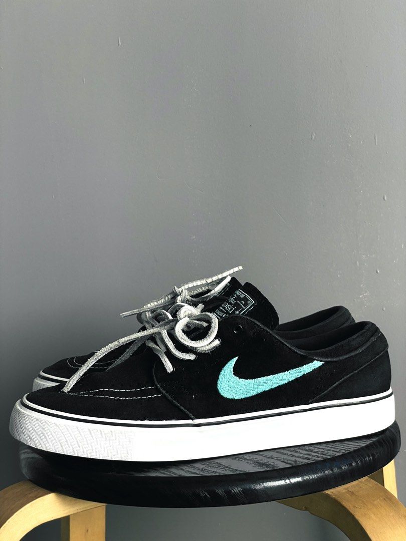Nike SB Stefan Janoski Black Tiffany (Category: Sneakers) located in Caloocan City. Submitted by ceflores97696 (Listing ID 1470841836, Image 1). Description: - Model: Nike Stefan Janoski skate shoes - Upper: Black suede with vibrant turquoise embroidered swoosh - Details: Signature teal tongue label, clean stitching, and grey leather laces included - Sole: White vulcanized midsole with black outsole offering solid grip - Condition: Minimal wear o