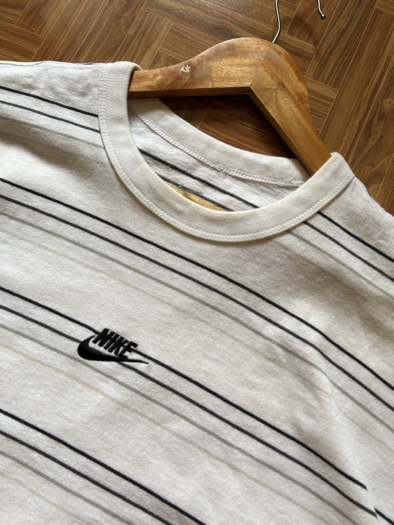 Nike Striped T-Shirt (Category: Tshirts & Polo Shirts ) located in San Fernando. Submitted by erison.cruz26 (Listing ID 1470819640, Image 2). Description: - Brand: Nike - Design: White with black & grey horizontal stripes, embroidered chest logo - Size: XXL (Regular fit) - Material: 100% Cotton (Made in China) - Condition: Brand new / Excellent - Style: Crew neck, short sleeves, easy casual wear -DIMENSION: 23*29.