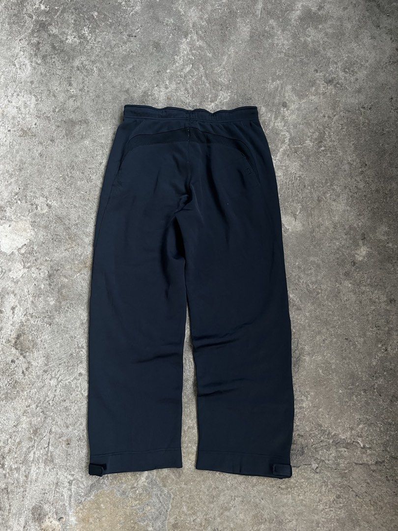 Nike Training Track Pants Black Teal Drawstring (Category: Joggers) located in Caloocan City. Submitted by fairfits (Listing ID 1470792113, Image 3). Description: - Brand: Nike - Color: Black with teal accents and inner waistband - Fit: Secure drawstring closure and adjustable buckle cuffs at the hems - Pockets: Convenient zippered pockets on the sides - Condition: Good overall, with a small damage spot near the lower left leg (refer to pictures)