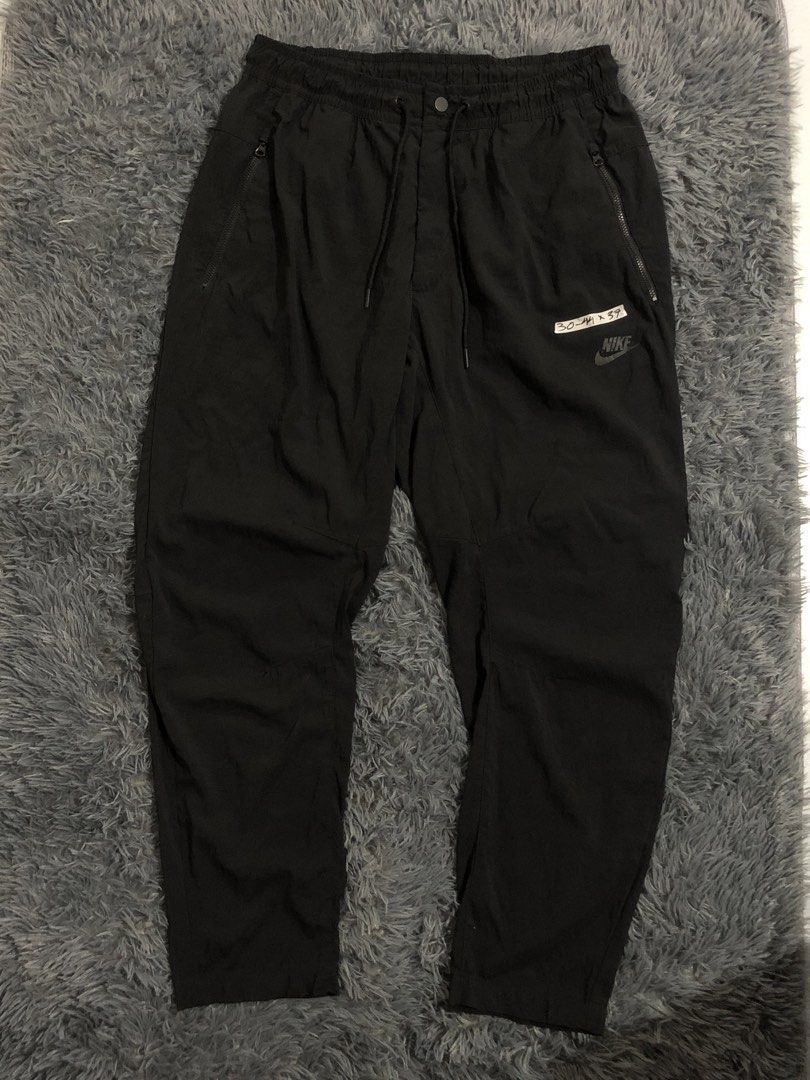 Nike Woven Pants - Triple Black (Category: Joggers) located in Manila. Submitted by raremountain00 (Listing ID 1470904850, Image 1). Description: Authentic Excellent condition No issue.