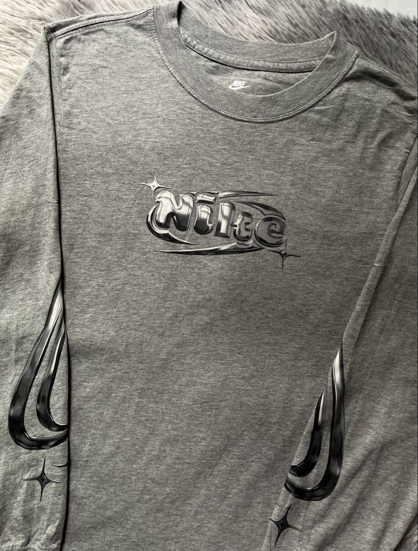 Nike Y2K Metallic Liquid Silver (Category: Coats, Jackets and Outerwear) located in Caloocan City. Submitted by kaeleinn (Listing ID 1470792494, Image 2). Description: Nike Y2K Metallic Liquid Silver 19" width 27" length excellent condition, Y2K chrome liquid silver style 900 + sf 📥.
