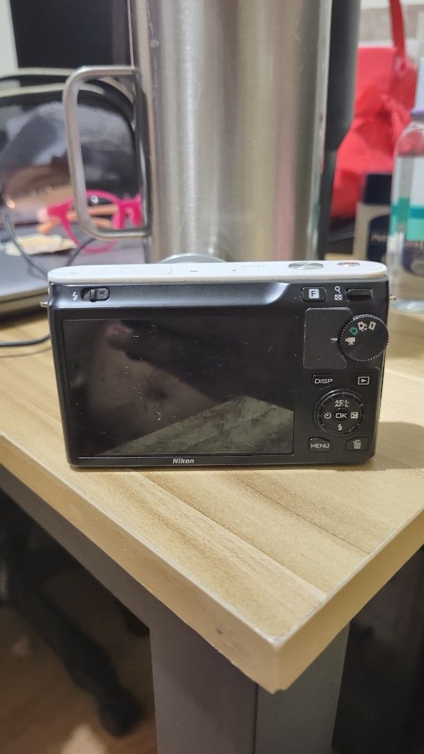 Nikon 1 J1 Mirrorless Defective - No power (Category: Cameras) located in Manila. Submitted by lasampana50217 (Listing ID 1470803661, Image 2). Description: - White Nikon 1 J1 mirrorless camera body with lens - Includes original Nikon MH-27 battery charger and rechargeable battery - Body and lens show normal signs of handling wear -Screen has heavy vignetting, lens not working (lens error) -with pouch lang no carrying bag/case no box. RFS- wala n