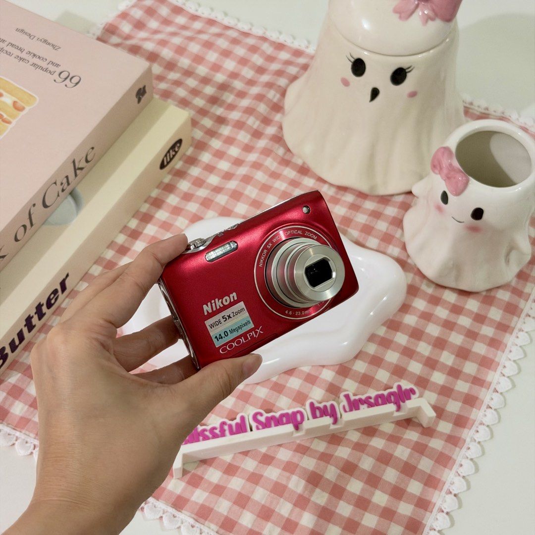 Nikon Coolpix S3100 Red Digital Camera (Category: Cameras) located in Manila. Submitted by decluttered_by.kisses (Listing ID 1470849946, Image 3). Description: Model: Nik♡n Coolpix S3100 ♡₊˚ - crisp outputs! price: [🔖 ₱6,299 + SF ] ╰┈➤ comment “mine” 🛒 IG: @blissful.snap FB Page: Blissful Snap Tiktok: @ blissful.snap 🌸 𝗱𝗲𝘁𝗮𝗶𝗹𝘀: 📸 – Key Features • 14MP CCD Sensor • 5× Optical Zoom (26–130mm) • 2.7” LCD Screen • ISO 80–3200 • HD 720p Vid