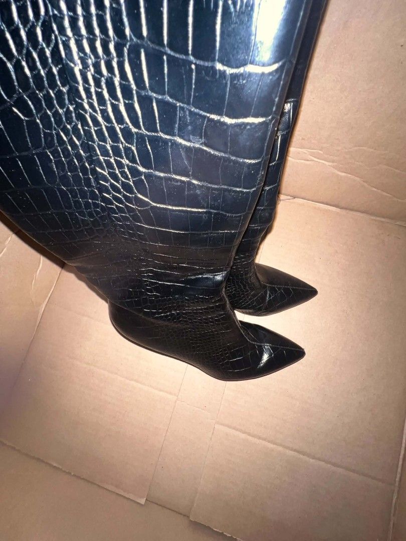 Nine West Black crocodile embossed knee high pointed toe boots (Category: Boots) located in Manila. Submitted by sthomibby (Listing ID 1470854371, Image 3). Description: Black knee-high boots with a glossy finish and trendy crocodile embossed pattern - Size : 7& 1/2 M - Design: Elegant pointed toes and sleek stiletto heels - Closure: Easy side zipper closure for a snug and comfortable fit - Bought in US ​📦 Transaction Details ​Shipping: Availabl