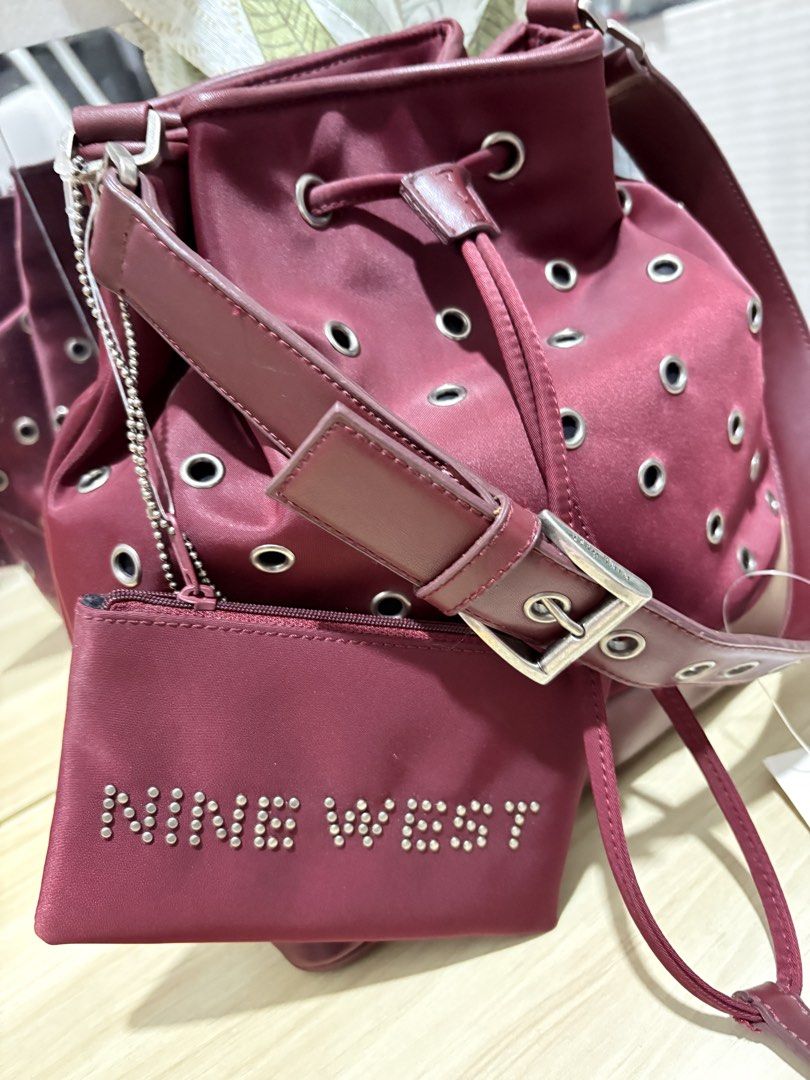 NINE WEST BUCKET BAG (Category: Shoulder Bags) located in Quezon City. Submitted by closetavenue (Listing ID 1470851298, Image 2). Description: •Elegant maroon/wine color • bucket bag with eyelet details • With detachable long strap • Includes matching pouch 🏷️ Brand New / With Tag Perfect for everyday use, office, or casual outfit. Classy and spacious easy to pair with different looks! .