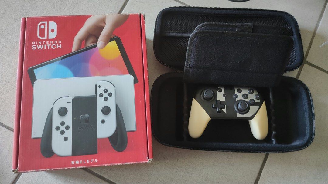 Nintendo Switch (Category: Nintendo) located in Quezon City. Submitted by aliceinwonderland007 (Listing ID 1470777764, Image 1). Description: - Nintendo Switch OLED Model (White) with original box - Includes Black Skull & Co. Carrying Case - Includes Official Nintendo Pro Controller - 4 Physical Games included: * The Legend of Zelda: Breath of the Wild * Animal Crossing: New Horizons * It Takes Two * Overcooked! Special Edition + Overcooked! 2 - 