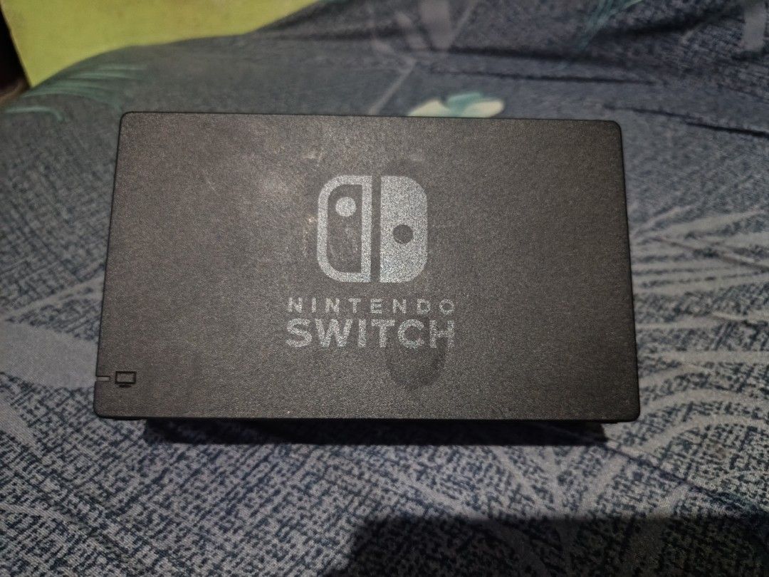 Nintendo Switch Console with Dock, Joy-Cons, and Case (Category: Nintendo) located in Manila. Submitted by ralphsanto27811 (Listing ID 1470774546, Image 2). Description: - Nintendo Switch Console with Neon Blue and Neon Red Joy-Cons - Includes TV dock, power adapter, and HDMI cable - Comes with Joy-Con grip, two wrist straps, and a red carrying case - Screen is fully functional in great working condition - Minor cosmetic wear on the carrying case