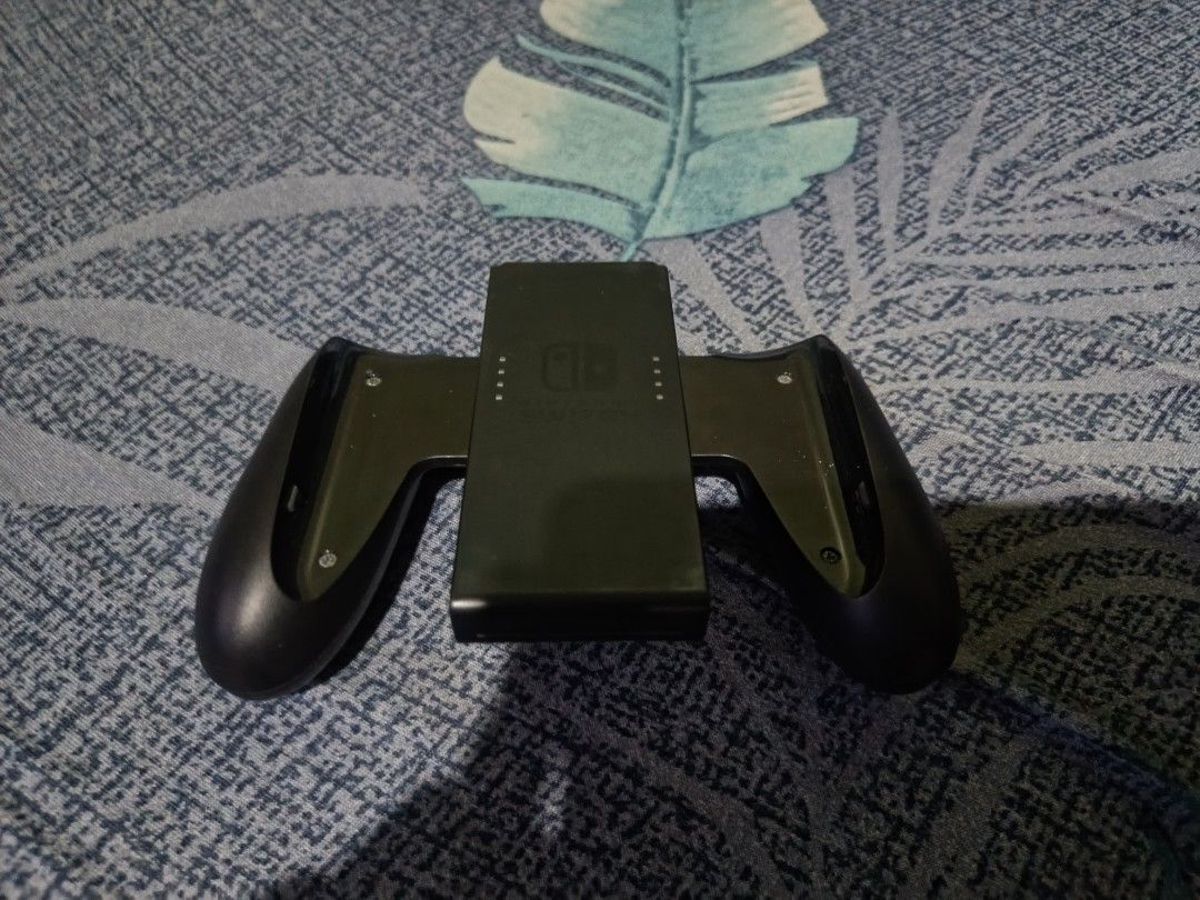 Nintendo Switch Console with Dock, Joy-Cons, and Case (Category: Nintendo) located in Manila. Submitted by ralphsanto27811 (Listing ID 1470774546, Image 3). Description: - Nintendo Switch Console with Neon Blue and Neon Red Joy-Cons - Includes TV dock, power adapter, and HDMI cable - Comes with Joy-Con grip, two wrist straps, and a red carrying case - Screen is fully functional in great working condition - Minor cosmetic wear on the carrying case
