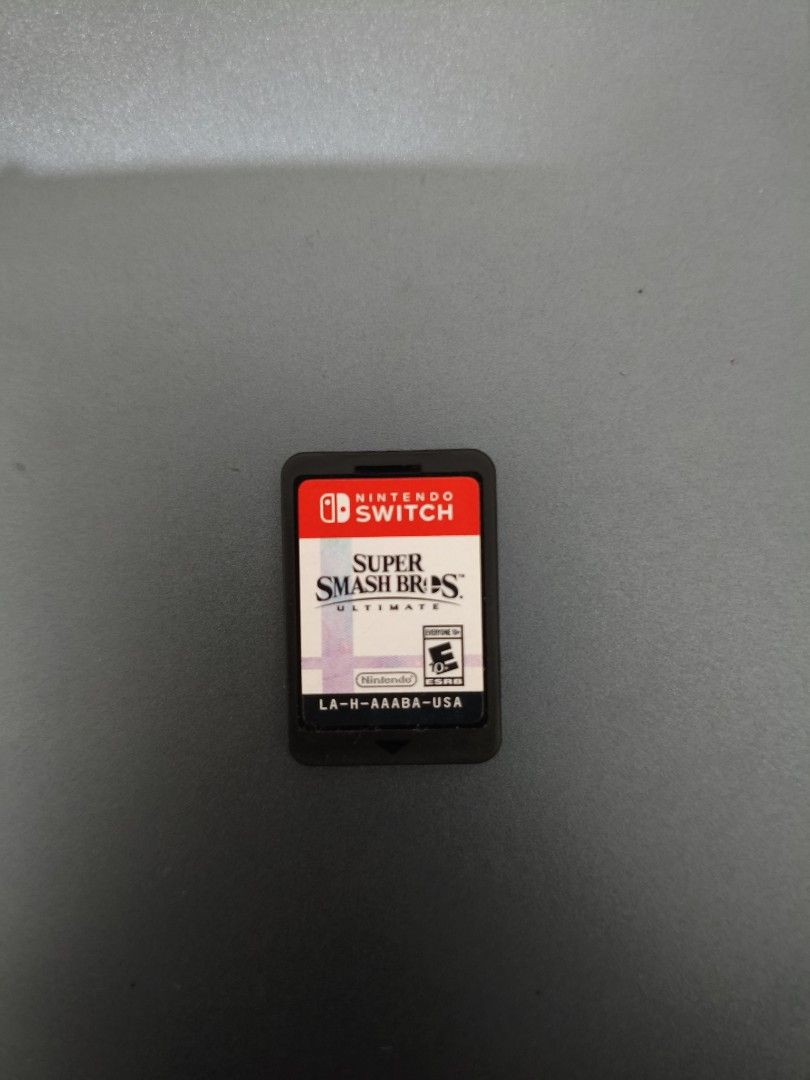 Nintendo Switch Super Smash Bros Ultimate Game Card (Category: Nintendo) located in Mandaluyong City. Submitted by cdraw (Listing ID 1470750860, Image 2). Description: - Game: Super Smash Bros Ultimate - Platform: Nintendo Switch (US Version, LA-H-AAABA-USA) - Condition: Cartridge only (No case), tested and working great - Delivery: Quick local meetup or lalamove pickup.