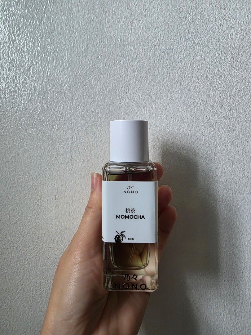 NONO Momocha Perfume 50ml (Category: Fragrance & Deodorants) located in Quezon City. Submitted by saiderr (Listing ID 1470871393, Image 1). Description: ALMOST FULL! missing a few sprays lang NONO Momocha fragrance - Capacity: 50ml - Scent Profile: Perfect for peach tea lovers - Reason for selling: Not my scent profile COURIER FEE/SHIPPING FEE NOT INCLUDED.