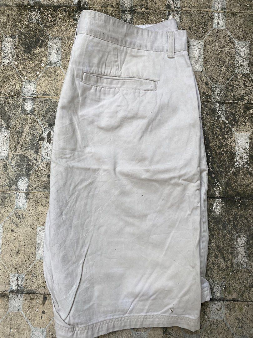 Oakley Tan Casual Shorts Size 40 (Category: Shorts) located in Imus. Submitted by frootiloots4103 (Listing ID 1470768340, Image 2). Description: - Brand: Oakley - Color: Cream / Light Tan - Size: 40 waist (Length: 23", Inseam: 13" based on tag) - Material: 100% Cotton - Details: Button closure with zipper fly, back pocket, branded Oakley hardware - Origin: Made in Macau - Condition: Pre-loved with some visible staining on the fabric OPEN FOR NEGO