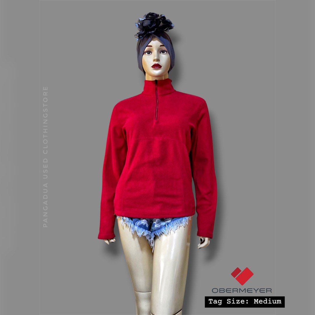 Obermeyer Red Half-Zip Fleece Pullover (Category: Coats, Jackets and Outerwear) located in Naga. Submitted by 2ndusedclothingstore (Listing ID 1470847553, Image 1). Description: - Brand: Obermeyer - Color: Bright Red - Size: Medium - Material: Soft, warm fleece - Features: Half-zip neckline, long sleeves - Origin: Made in Vietnam - Care: Machine washable - Best for: Cold weather and outdoor layering.