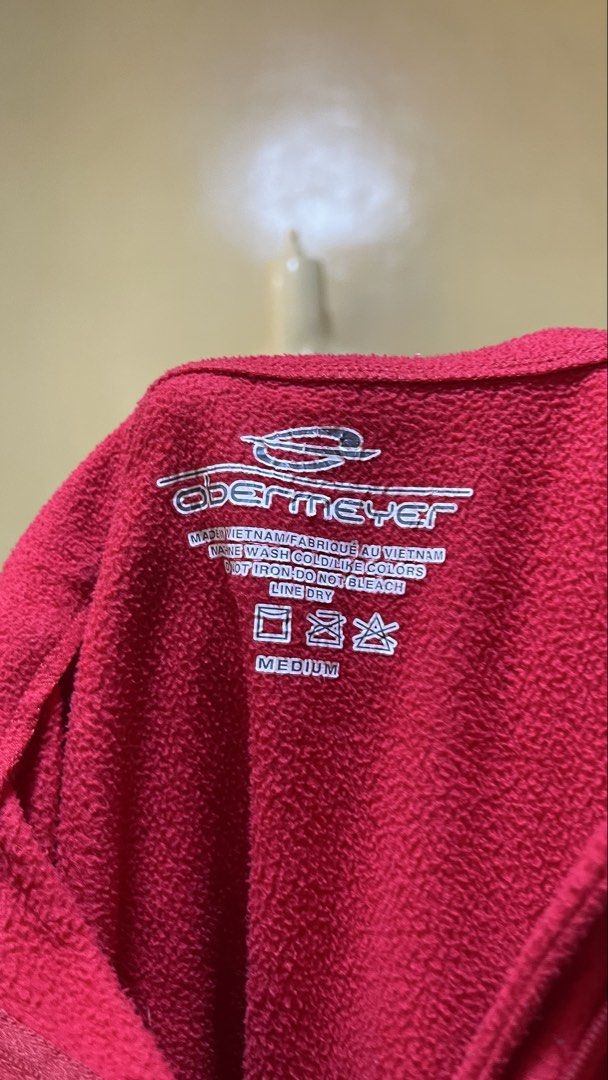 Obermeyer Red Half-Zip Fleece Pullover (Category: Coats, Jackets and Outerwear) located in Naga. Submitted by 2ndusedclothingstore (Listing ID 1470847553, Image 2). Description: - Brand: Obermeyer - Color: Bright Red - Size: Medium - Material: Soft, warm fleece - Features: Half-zip neckline, long sleeves - Origin: Made in Vietnam - Care: Machine washable - Best for: Cold weather and outdoor layering.