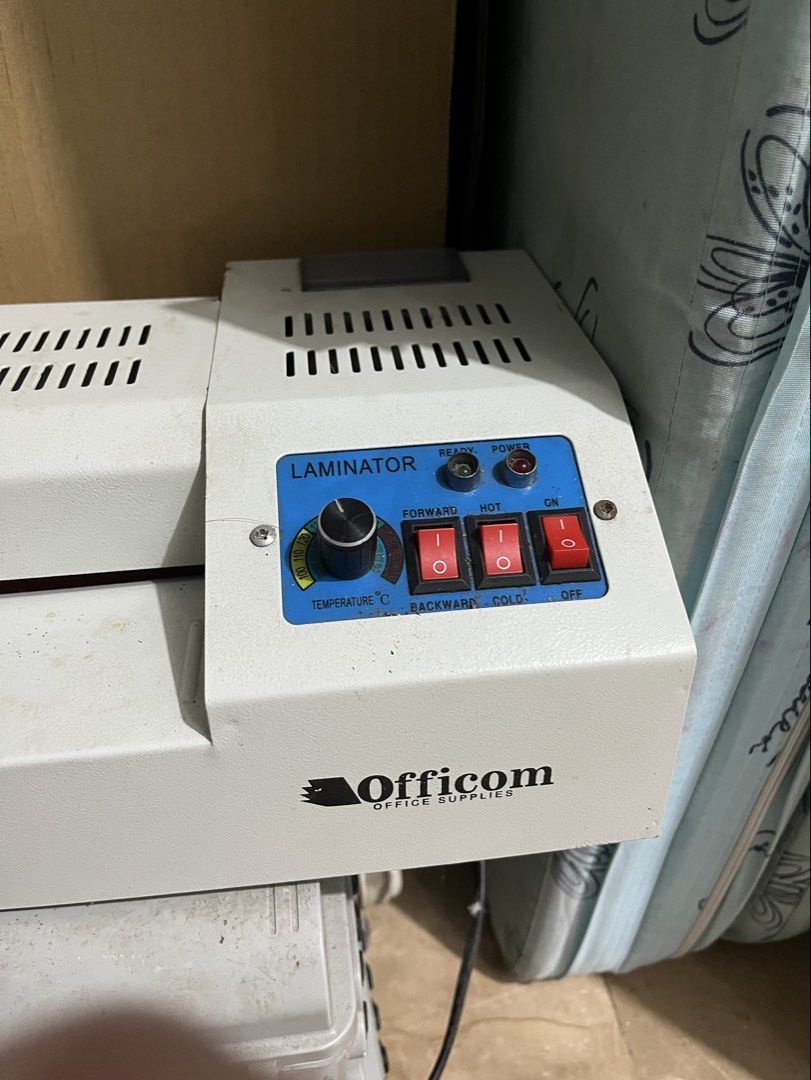 Officom Heavy Duty Office Laminator Machine (Category: Office & Business Technology) located in Pasay City. Submitted by pinedamary44900 (Listing ID 1470922552, Image 2). Description: - Brand: Officom Heavy Duty Office Laminator - Perfect for: Documents, certificates, and photos - Build: Sturdy heavy metal body in white - Controls: Temperature dial, forward/backward switches, and hot/cold settings - Indicators: Ready and power indicator lights - 