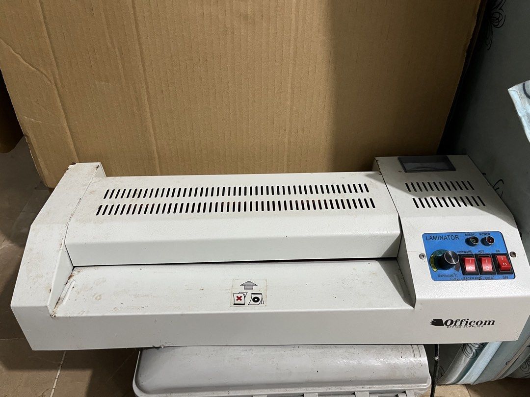 Officom Heavy Duty Office Laminator Machine (Category: Office & Business Technology) located in Pasay City. Submitted by pinedamary44900 (Listing ID 1470922552, Image 1). Description: - Brand: Officom Heavy Duty Office Laminator - Perfect for: Documents, certificates, and photos - Build: Sturdy heavy metal body in white - Controls: Temperature dial, forward/backward switches, and hot/cold settings - Indicators: Ready and power indicator lights - 