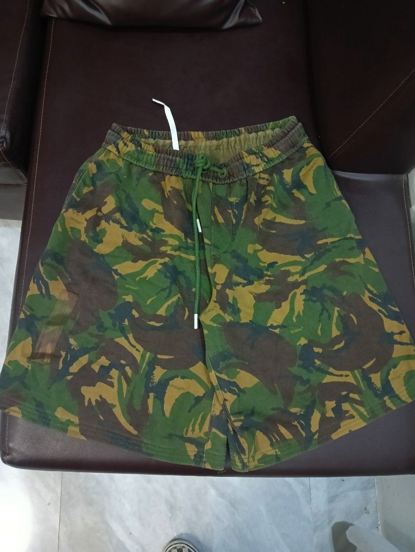 Off-White Camouflage Diagonals Shorts (Category: Shorts) located in Odiongan. Submitted by thrifthub_bundang07 (Listing ID 1470804419, Image 3). Description: - Authentic Off-White c/o Virgil Abloh green camouflage shorts - Made from 100% comfortable cotton with interior main label branding - Features signature diagonal stripes on the leg - Equipped with an adjustable drawstring waistband for a custom fit - Clean fabric condition, perfect for casu