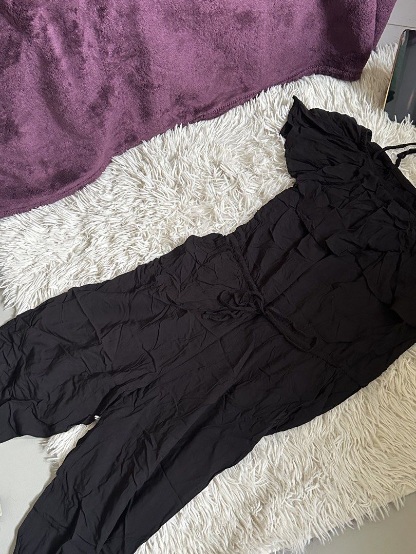 Old Navy Black Ruffle Jumpsuit Small (Category: Jumpsuits) located in Taguig. Submitted by appatheseller (Listing ID 1470846963, Image 2). Description: Fits L-Xl - Brand: Old Navy - Color: Black - Size: Small (S) - Style: Cold shoulder with ruffles and thin straps - Waist: Adjustable drawstring - Fabric: Comfortable and lightweight - Condition: Excellent - Perfect for: Casual outings and warm weather days.