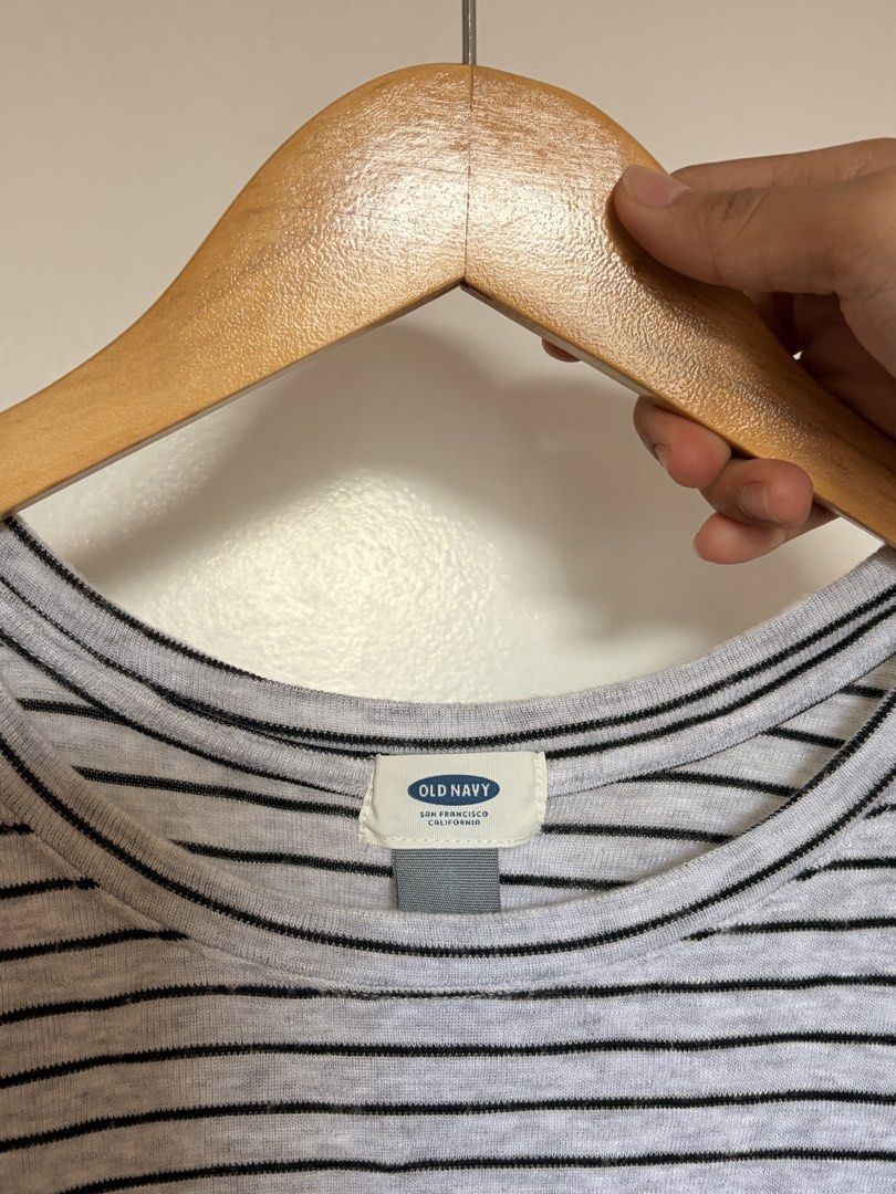 Old Navy Grey Striped Long Sleeve Shirt (Category: Longsleeves) located in Marikina City. Submitted by _bananahanaa (Listing ID 1470804576, Image 2). Description: - Brand: Old Navy - Color: Grey with black horizontal stripes - Neckline: Scoop neck - Sleeves: Three-quarter length - Material: Lightweight knit - Fit: Relaxed and comfortable for everyday wear fits small-medium.