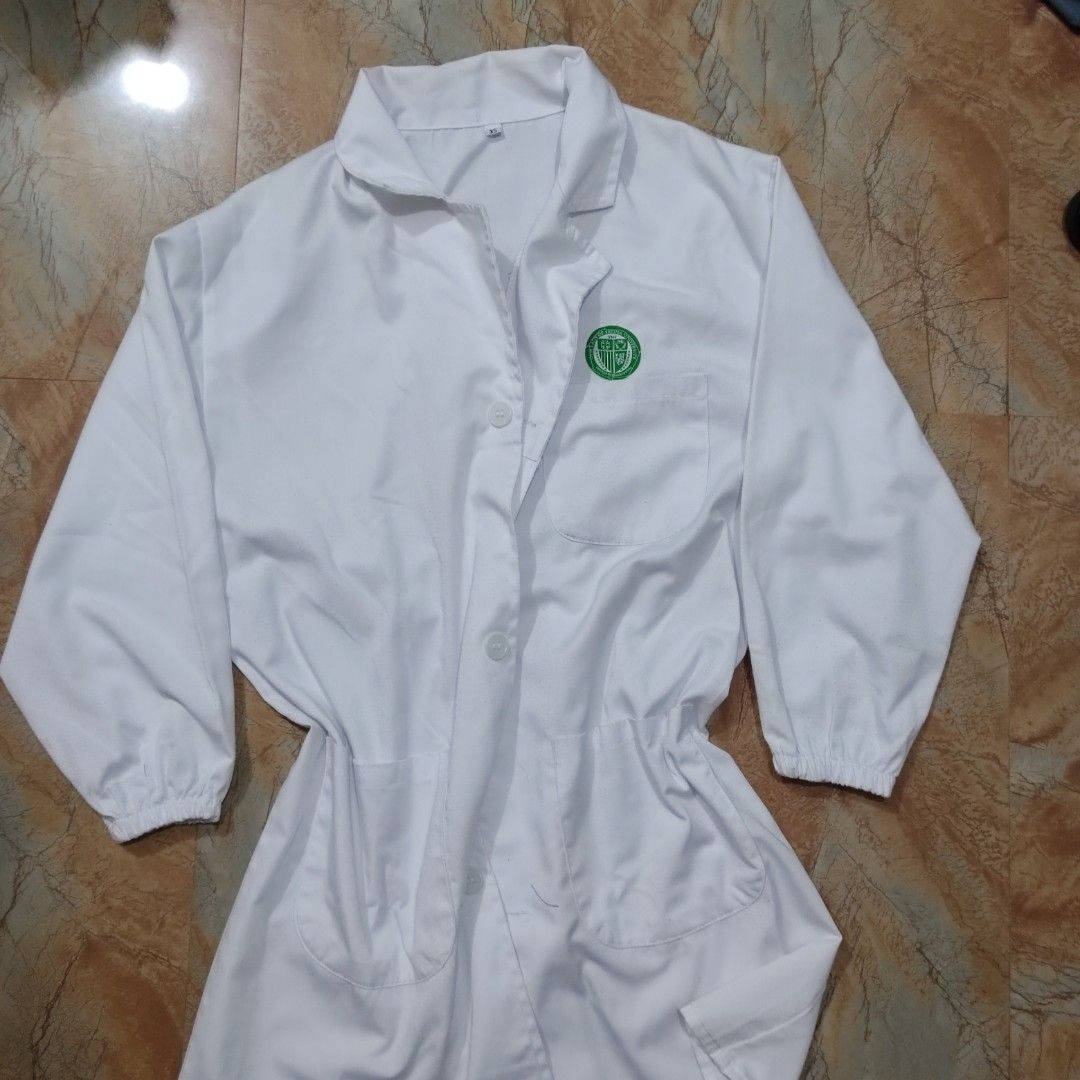 OLFU Medtech Lab Gown | XS (Category: Coats, Jackets and Outerwear) located in Valenzuela. Submitted by 0003c4 (Listing ID 1470856744, Image 1). Description: white lab gown with long sleeves and front buttons Size XS, features front pockets and elastic cuffs Preloved; has minor visible marks/stains (see photos) location Valenzuela or Malabon mod lalamove or jnt.