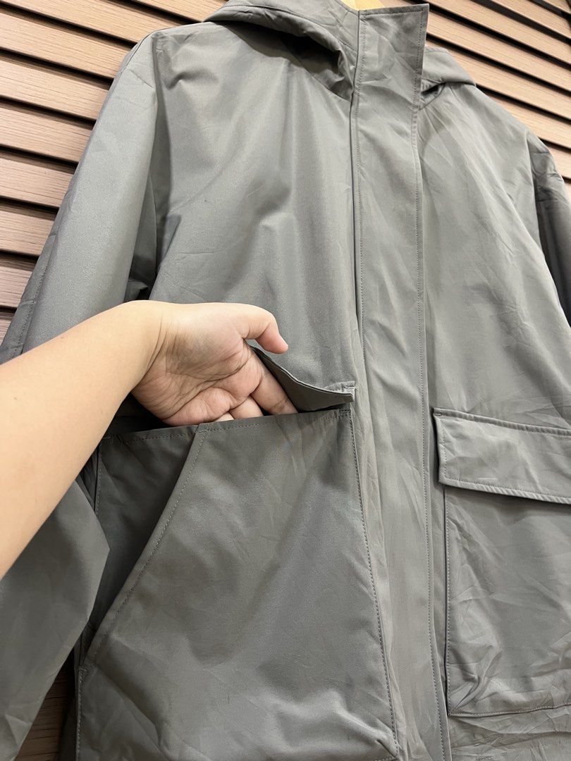 Olive Green Hooded Utility Jacket with Front Pockets (Category: Coats, Jackets and Outerwear) located in Mabalacat. Submitted by fashionclothesph (Listing ID 1470845630, Image 3). Description: - Color: Trendy olive green - Width 22inches - Length 27inches - Style: Lightweight hooded utility jacket with a loose fit - Closure: Full zip front with a snap-button storm flap - Pockets: Two large front flap pockets plus convenient side hand pockets - Pe