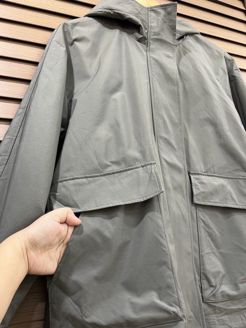 Olive Green Hooded Utility Jacket with Front Pockets (Category: Coats, Jackets and Outerwear) located in Mabalacat. Submitted by fashionclothesph (Listing ID 1470845630, Image 2). Description: - Color: Trendy olive green - Width 22inches - Length 27inches - Style: Lightweight hooded utility jacket with a loose fit - Closure: Full zip front with a snap-button storm flap - Pockets: Two large front flap pockets plus convenient side hand pockets - Pe
