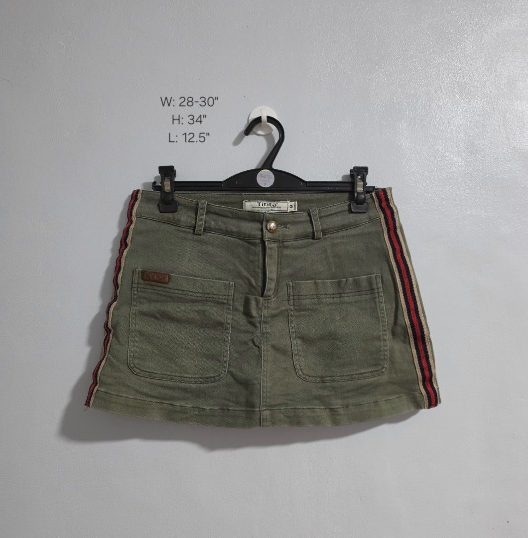 Olive Green Skort with Side Stripes Size M (Category: Skirts) located in Paranaque City. Submitted by franinnashop (Listing ID 1470839719, Image 1). Description: Declutter •Olive green skort from Titita in size M (160/80A). •Built-in inner shorts for extra comfort and coverage. •Two large front pockets with a small brown leather patch, plus two faux welt pockets on the back. •Red, navy, and beige side stripes add casual sport vibe. •Waist measure