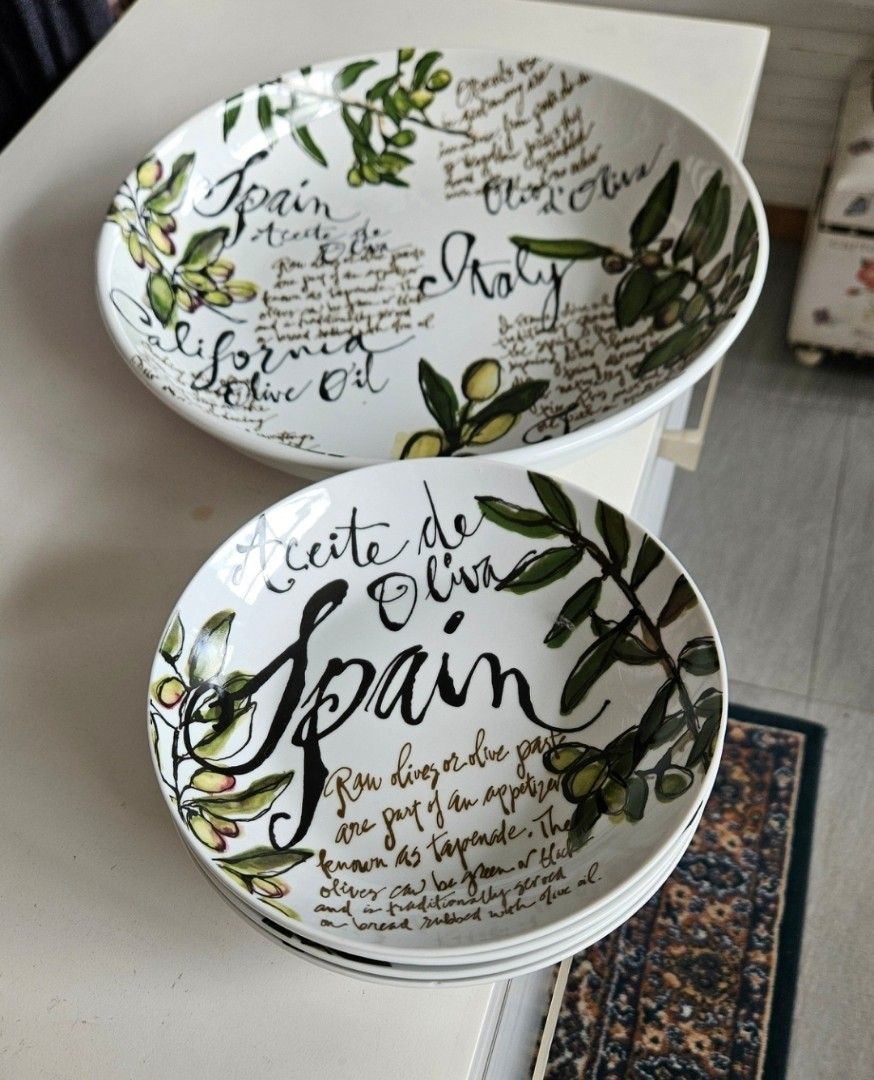 Olive themed ceramic bowls set with typography and art (Category: Dinnerware & Cutlery) located in Manila. Submitted by cosmicshark-cd31f1 (Listing ID 1470822391, Image 3). Description: - Set includes 4 individual bowls and 1 large matching serving bowl - Features charming olive branch illustrations and typography of famous olive regions (Spain, Italy, California, France) - Made of durable white ceramic with classic black typography and green acc