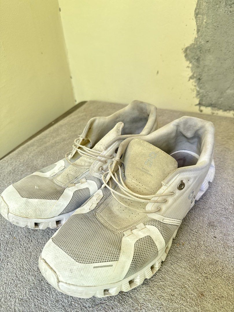 On Cloud Running Shoes White (Category: Sneakers) located in Calamba. Submitted by xacalixa (Listing ID 1470799684, Image 3). Description: - Brand: On Cloud - Color: White - Style: Everyday running shoes / trainers - Features: Speed lacing system, breathable mesh upper, cushioned CloudTec sole - Condition: Noticeable signs of wear on the fabric and soles, priced accordingly.