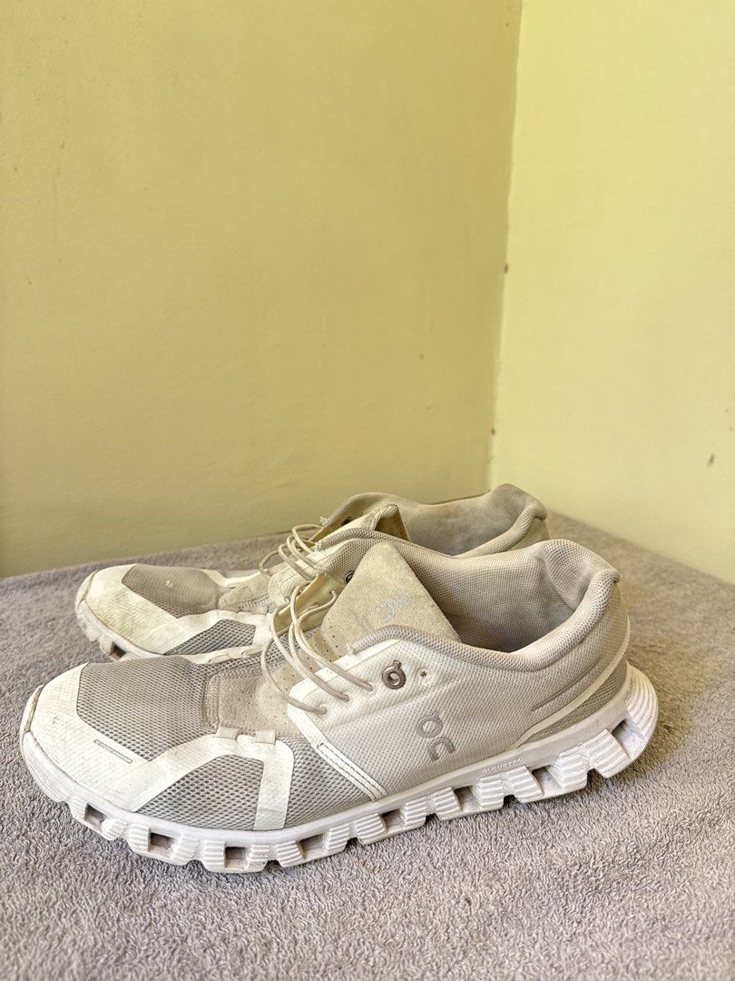 On Cloud Running Shoes White (Category: Sneakers) located in Calamba. Submitted by xacalixa (Listing ID 1470799684, Image 2). Description: - Brand: On Cloud - Color: White - Style: Everyday running shoes / trainers - Features: Speed lacing system, breathable mesh upper, cushioned CloudTec sole - Condition: Noticeable signs of wear on the fabric and soles, priced accordingly.