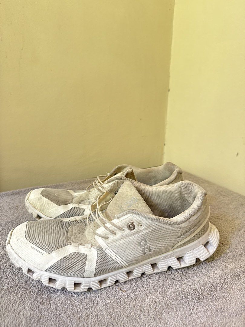 On Cloud Running Shoes White (Category: Sneakers) located in Calamba. Submitted by xacalixa (Listing ID 1470799684, Image 1). Description: - Brand: On Cloud - Color: White - Style: Everyday running shoes / trainers - Features: Speed lacing system, breathable mesh upper, cushioned CloudTec sole - Condition: Noticeable signs of wear on the fabric and soles, priced accordingly.