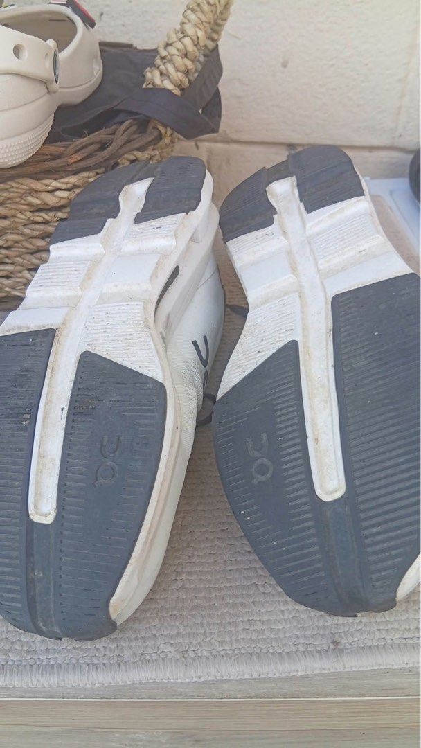 On Cloud Running Shoes White Black (Category: Sneakers) located in Muntinlupa City. Submitted by ashley.18 (Listing ID 1470767852, Image 3). Description: - Brand: On Running Shoes - Color: Classic White and Black - Style: Iconic Cloud design with convenient speed-lacing system - Material: Breathable mesh upper for maximum airflow - Condition: Good pre-owned condition with plenty of tread left on rubber outsoles - Flaws: Visible scuffs/dirt marks 
